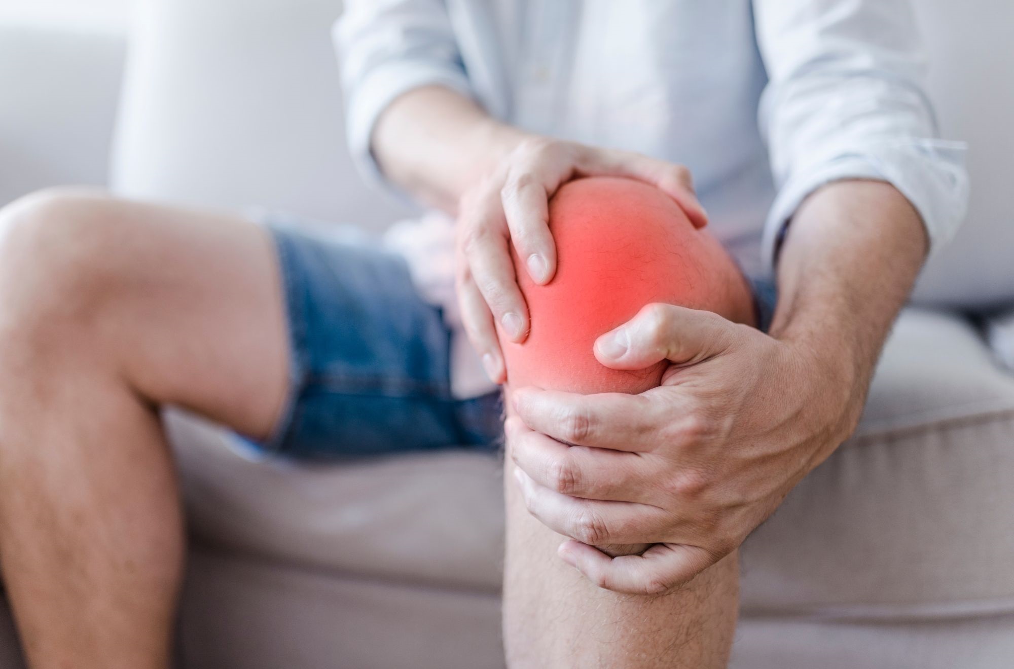 A Man Suffering From A Knee Pain.